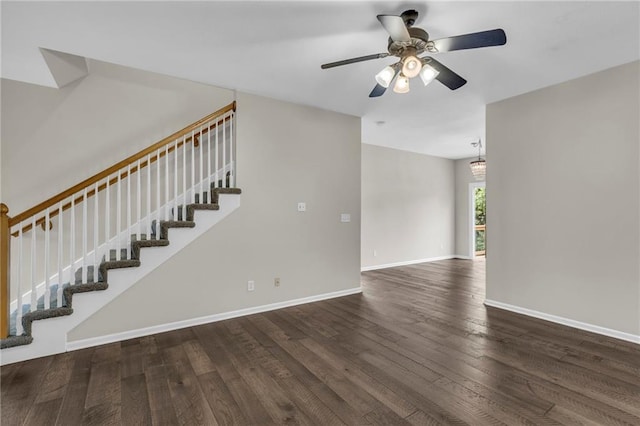 interior space with stairway, baseboards, a ceiling fan, and wood finished floors