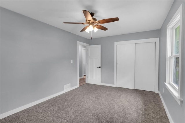512 W 6th St, Carrollton, MO 64633 - unfurnished bedroom featuring carpet flooring, baseboards, visible vents, and a closet