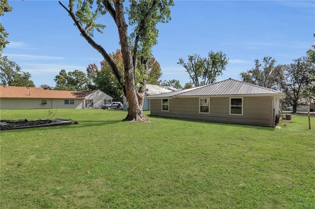 512 W 6th St, Carrollton, MO 64633 - view of yard featuring central air condition unit