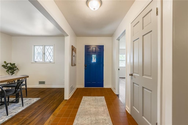 entrance foyer with visible vents and baseboards