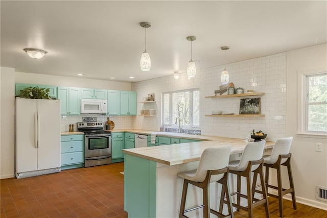 kitchen with open shelves, white appliances, a peninsula, tasteful backsplash, and blue cabinets