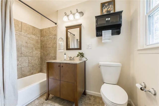 full bathroom featuring tile patterned flooring, baseboards, vanity, toilet, and shower / bath combo with shower curtain