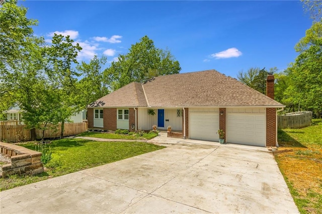 ranch-style home with fence, a chimney, a front lawn, and a garage