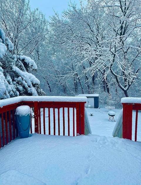 snowy yard featuring a deck