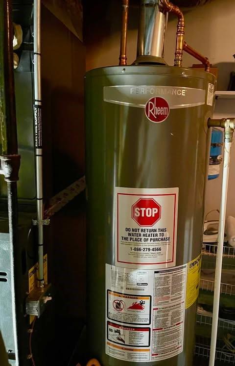 utility room featuring gas water heater