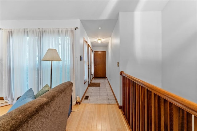 9629 N Locust Dr, Kansas City, MO 64155 - corridor featuring visible vents, light wood-style flooring, and baseboards