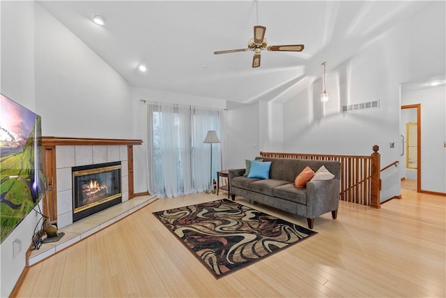 9629 N Locust Dr, Kansas City, MO 64155 - living area featuring ceiling fan, visible vents, wood finished floors, and vaulted ceiling