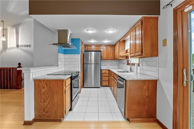9629 N Locust Dr, Kansas City, MO 64155 - kitchen featuring visible vents, island range hood, brown cabinets, a sink, and stainless steel appliances