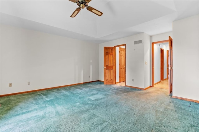 9629 N Locust Dr, Kansas City, MO 64155 - unfurnished bedroom with baseboards, visible vents, a ceiling fan, and light colored carpet