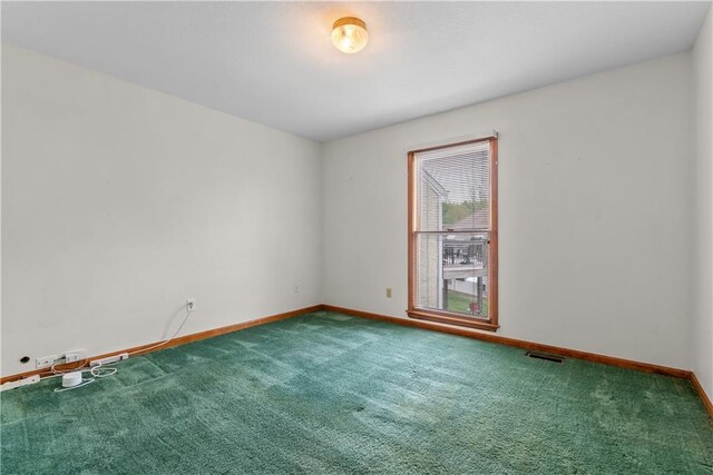 9629 N Locust Dr, Kansas City, MO 64155 - carpeted empty room with baseboards and visible vents