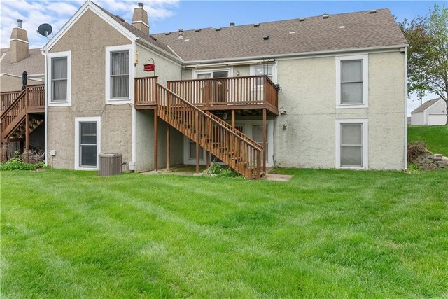 9629 N Locust Dr, Kansas City, MO 64155 - back of house with a deck, stucco siding, and stairway