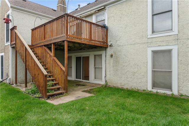 9629 N Locust Dr, Kansas City, MO 64155 - rear view of property with stairway, stucco siding, a yard, and a deck