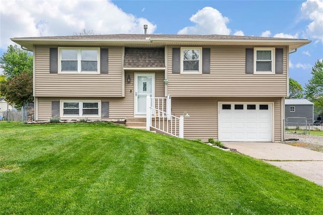 split foyer home with a garage and driveway