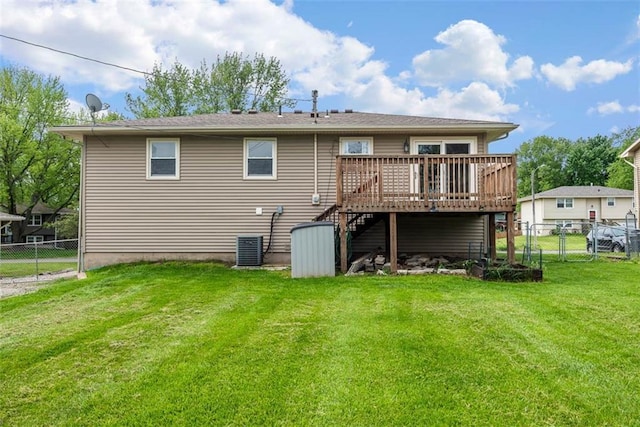 rear view of property with a deck, stairs, and central air condition unit