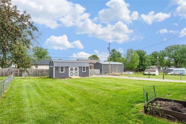 view of yard with a storage unit and an outbuilding