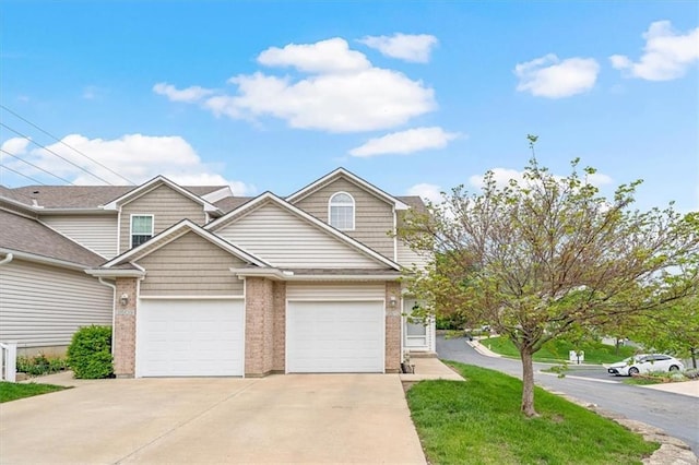 multi unit property with brick siding and driveway