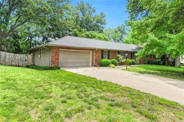 2217 Kingman St, Leavenworth, KS 66048 - ranch-style home with an attached garage, driveway, and brick siding
