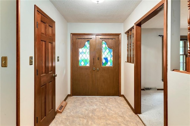 2217 Kingman St, Leavenworth, KS 66048 - foyer entrance with a textured ceiling