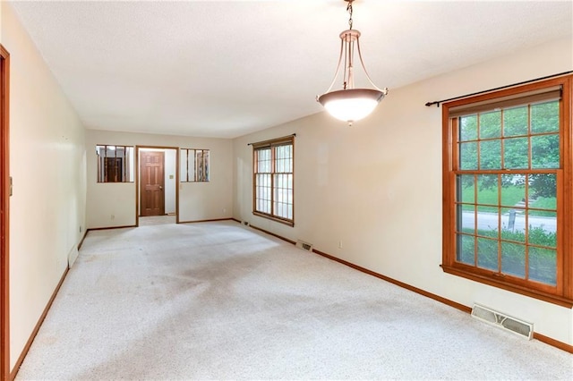 2217 Kingman St, Leavenworth, KS 66048 - spare room with healthy amount of natural light and light carpet