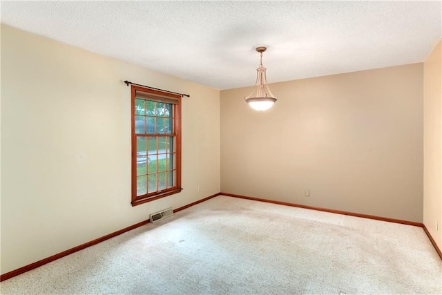2217 Kingman St, Leavenworth, KS 66048 - empty room featuring light carpet and a textured ceiling