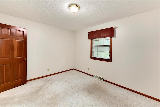 2217 Kingman St, Leavenworth, KS 66048 - spare room featuring light colored carpet and a textured ceiling