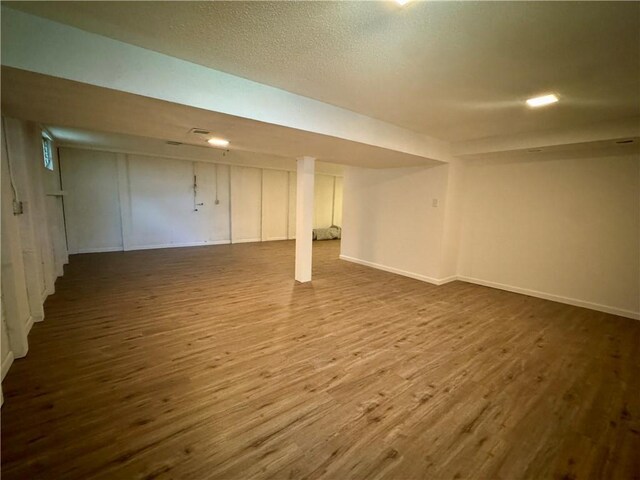 2217 Kingman St, Leavenworth, KS 66048 - finished basement with wood finished floors and baseboards