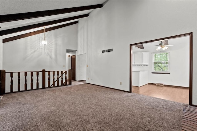 18104 E 24th St S, Independence, MO 64057 - carpeted empty room with high vaulted ceiling, ceiling fan, beamed ceiling, and baseboards