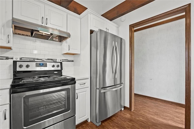 18104 E 24th St S, Independence, MO 64057 - kitchen featuring appliances with stainless steel finishes, under cabinet range hood, light countertops, dark wood-type flooring, and baseboards