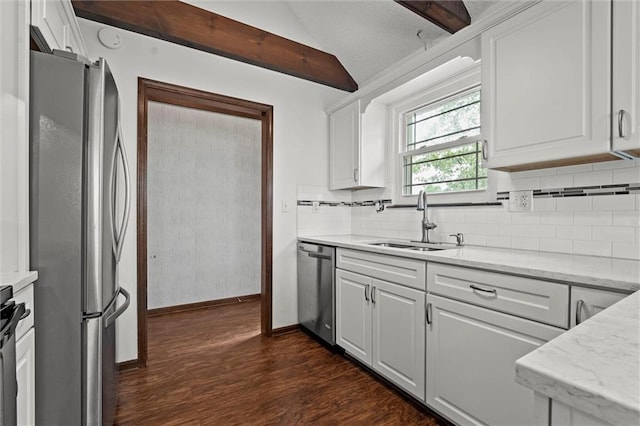18104 E 24th St S, Independence, MO 64057 - kitchen featuring stainless steel appliances, a sink, dark wood-style floors, tasteful backsplash, and vaulted ceiling