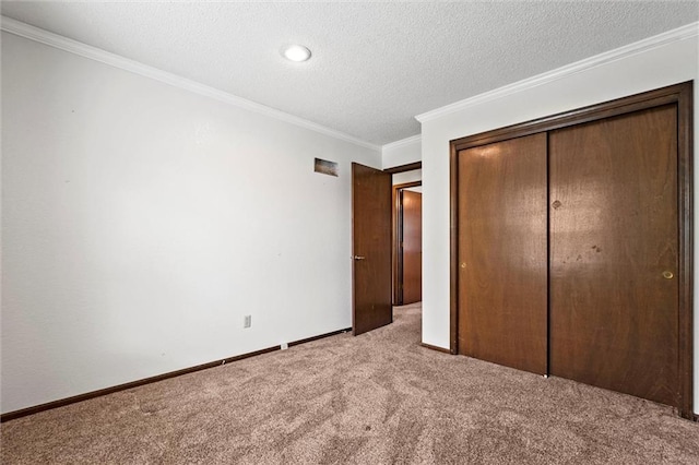 18104 E 24th St S, Independence, MO 64057 - unfurnished bedroom with carpet, ornamental molding, a closet, a textured ceiling, and baseboards