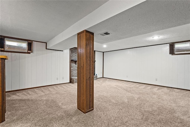 18104 E 24th St S, Independence, MO 64057 - basement featuring carpet, a textured ceiling, baseboards, wooden walls, and a wall unit AC