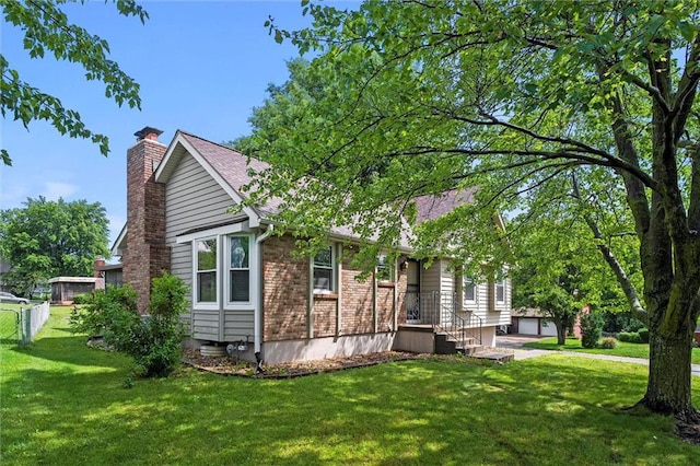 18104 E 24th St S, Independence, MO 64057 - view of home's exterior with a chimney and a yard