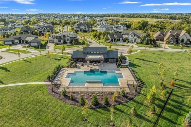 birds eye view of property with a residential view
