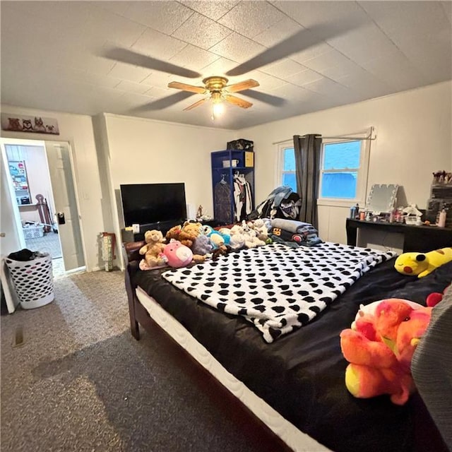 bedroom with ceiling fan and carpet