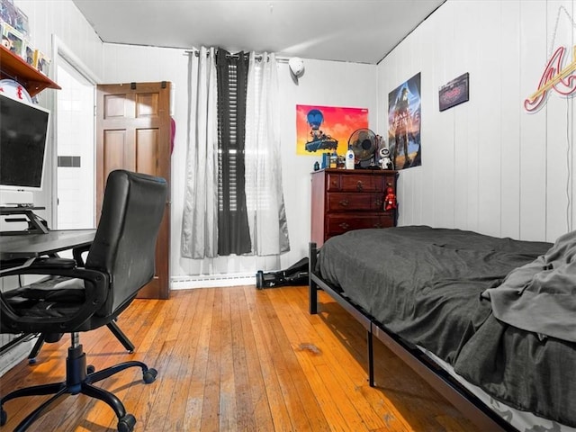 bedroom featuring wood-type flooring