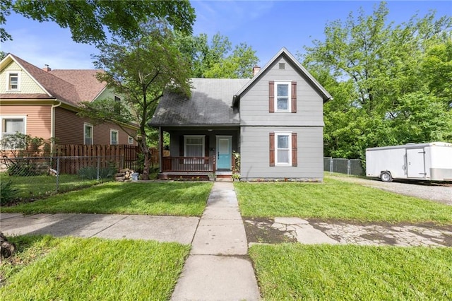 628 S Mulberry St, Ottawa, KS 66067 - view of front of home featuring covered porch and a chimney