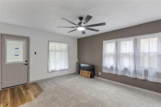 628 S Mulberry St, Ottawa, KS 66067 - foyer featuring ceiling fan, baseboards, and carpet