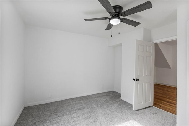 628 S Mulberry St, Ottawa, KS 66067 - spare room featuring carpet floors, baseboards, and ceiling fan
