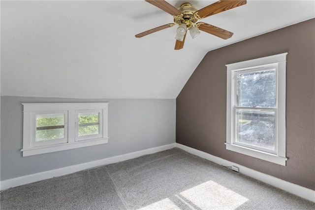628 S Mulberry St, Ottawa, KS 66067 - additional living space featuring healthy amount of natural light, vaulted ceiling, carpet, ceiling fan, and baseboards