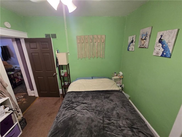 bedroom featuring carpet floors, baseboards, and visible vents