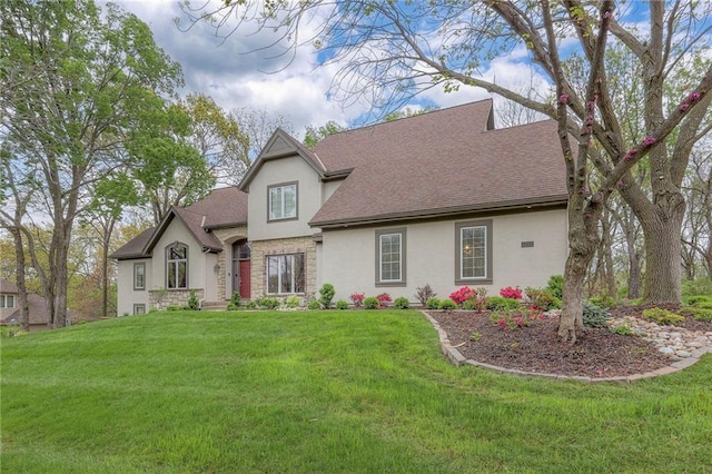 4411 N Mulberry Dr, Kansas City, MO 64116 - view of front of house featuring roof with shingles, a front yard, stone siding, and stucco siding