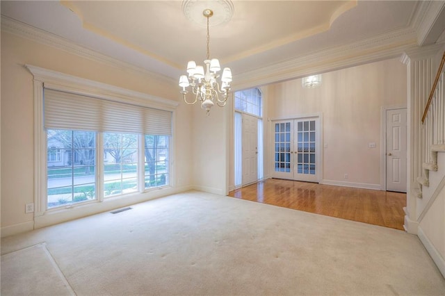 4411 N Mulberry Dr, Kansas City, MO 64116 - carpeted empty room with crown molding, french doors, and stairs