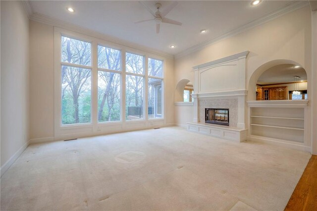 4411 N Mulberry Dr, Kansas City, MO 64116 - unfurnished living room featuring ornamental molding, baseboards, recessed lighting, a high end fireplace, and a ceiling fan
