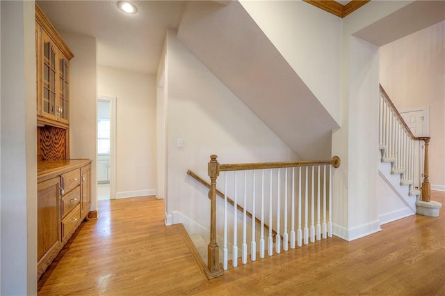 4411 N Mulberry Dr, Kansas City, MO 64116 - hall featuring recessed lighting, baseboards, an upstairs landing, and light wood-style floors