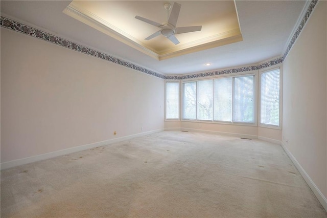 4411 N Mulberry Dr, Kansas City, MO 64116 - empty room featuring ceiling fan, crown molding, carpet floors, baseboards, and a tray ceiling