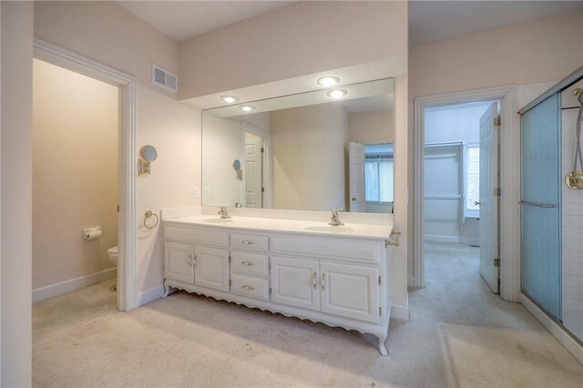 4411 N Mulberry Dr, Kansas City, MO 64116 - full bath featuring double vanity, visible vents, a sink, baseboards, and toilet