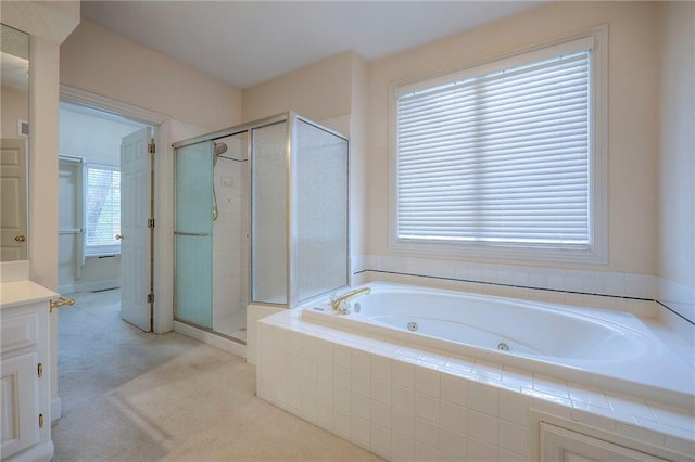 4411 N Mulberry Dr, Kansas City, MO 64116 - full bathroom featuring a jetted tub, vanity, and a stall shower