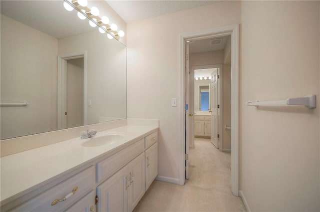 4411 N Mulberry Dr, Kansas City, MO 64116 - bathroom featuring baseboards, visible vents, and vanity