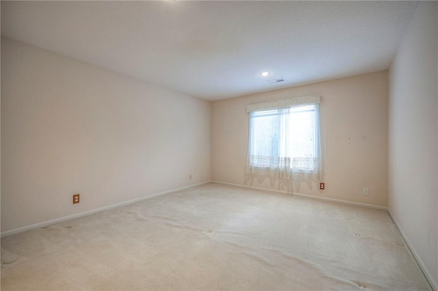 4411 N Mulberry Dr, Kansas City, MO 64116 - unfurnished room featuring baseboards, visible vents, and light colored carpet