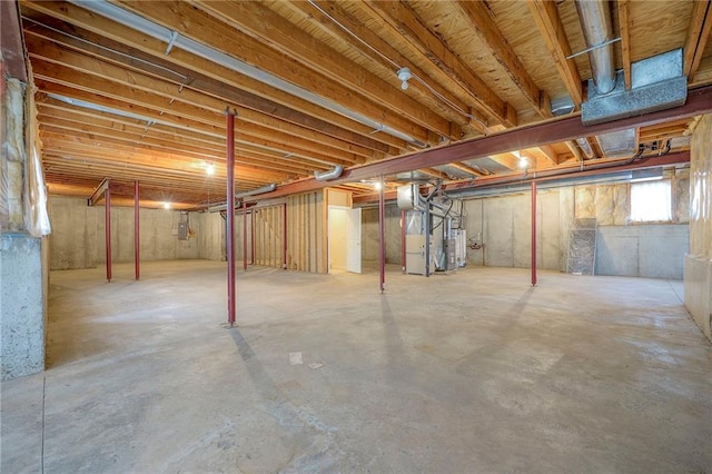 4411 N Mulberry Dr, Kansas City, MO 64116 - below grade area featuring heating unit and gas water heater